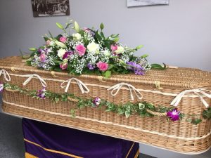 Eco-Friendly Coffin with floral tribute supplied by Albert Parr in Beckenham